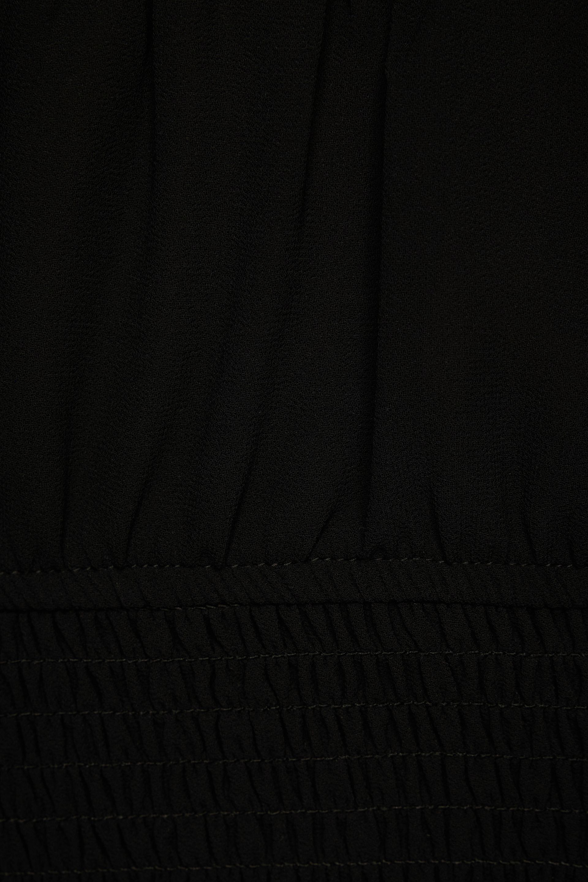 Lilie Balloon Sleeve Smocked Top Black | Dynamite