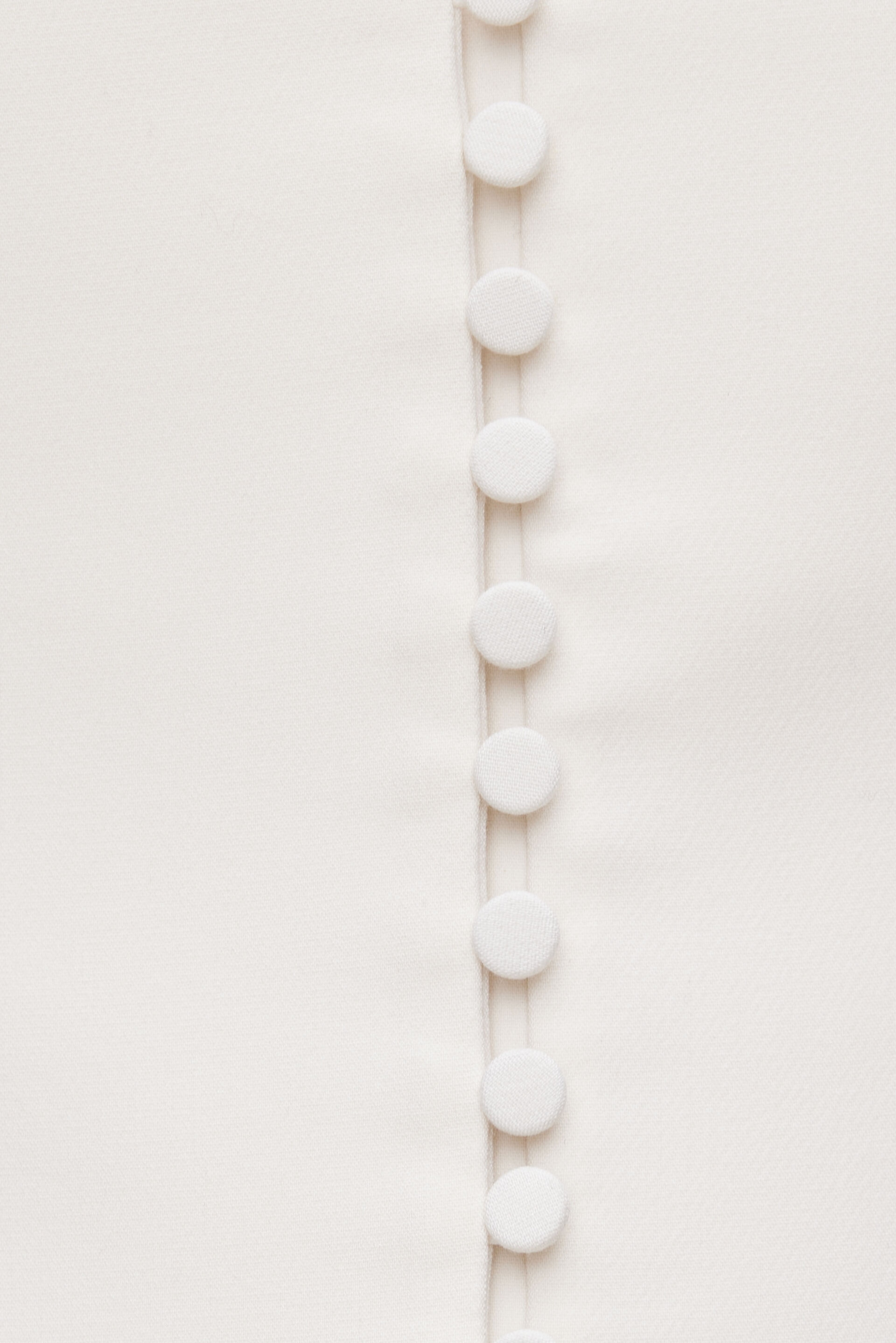 Veston plongeant à petits boutons