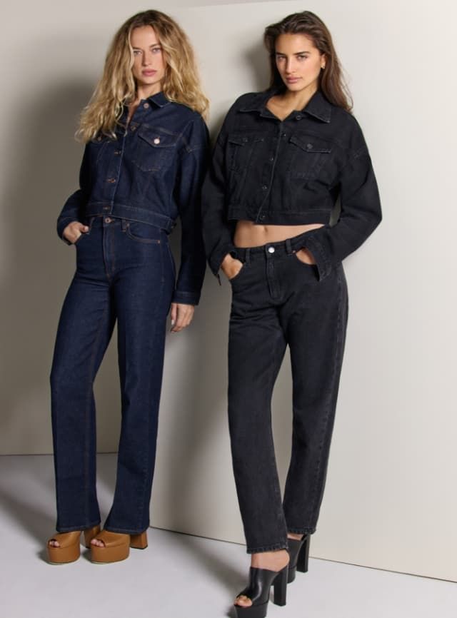 Two models wear denim jackets with slim jeans, one in all blue denim and the other in all black denim.