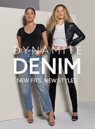One model wears blue distressed slim straight leg jeans with a black v-neck bodysuit and the other model wears black skinny jeans with a white tank top and a faux leather moto jacket.