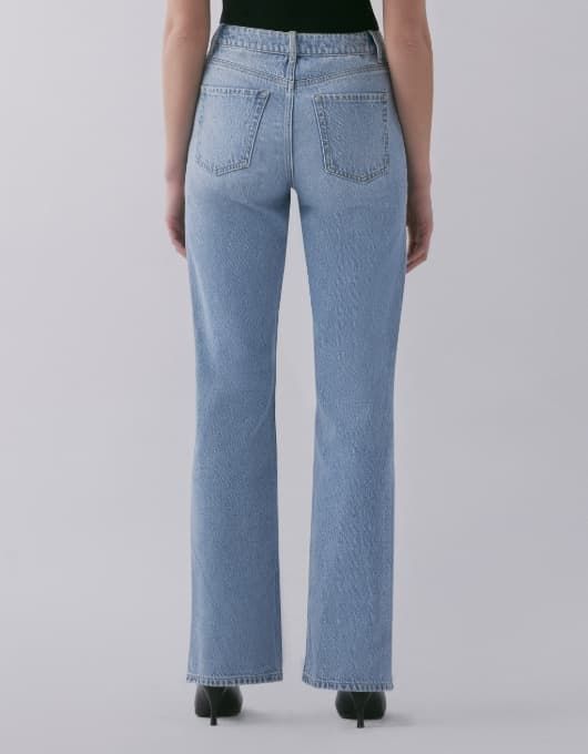 A model wears the Heidi jeans - back view.