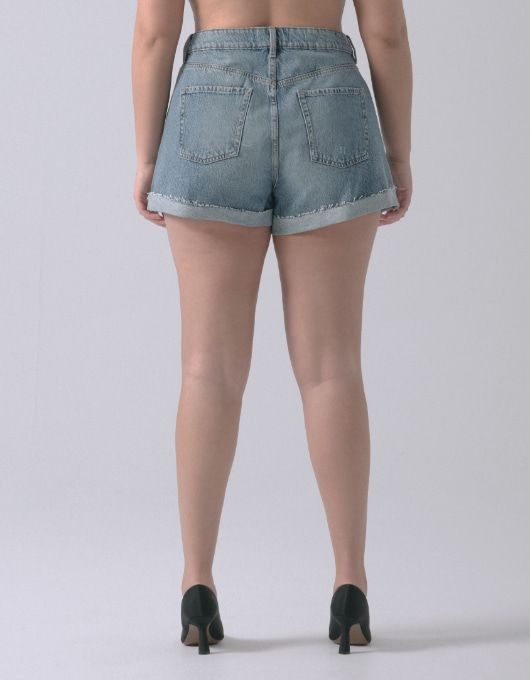 A model wears the shorts - back view.