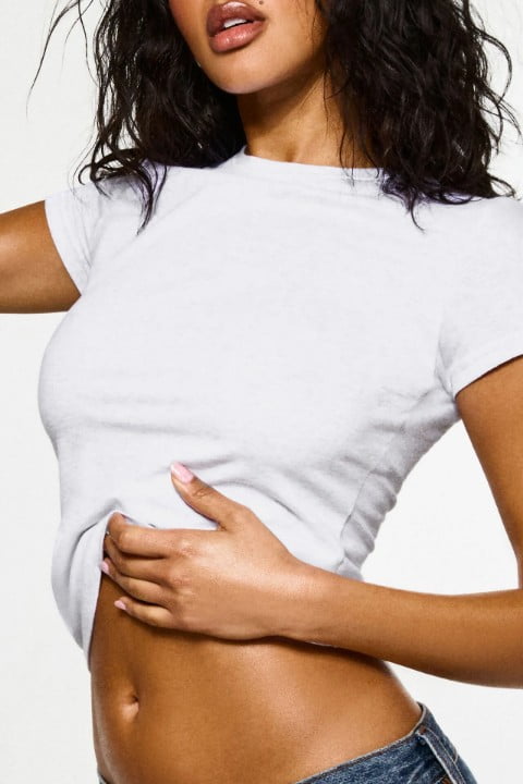 Model wears a white t-shirt.