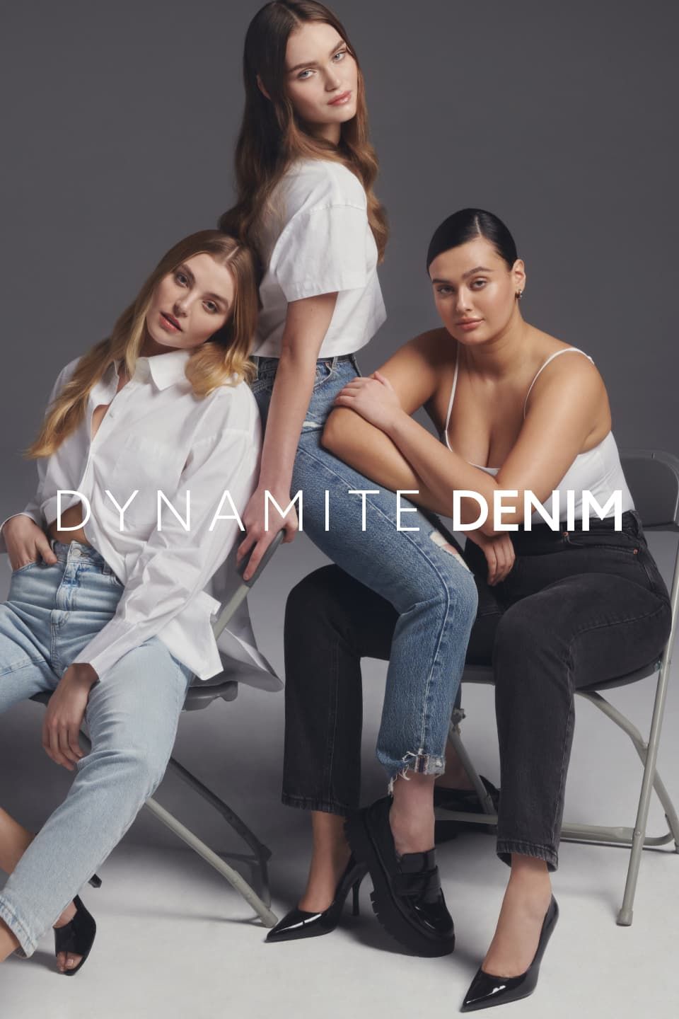 Three models wear light blue, dark blue and black jeans with white tops.