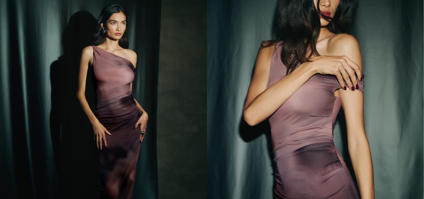 Model is wearing a printed purple maxi dress.