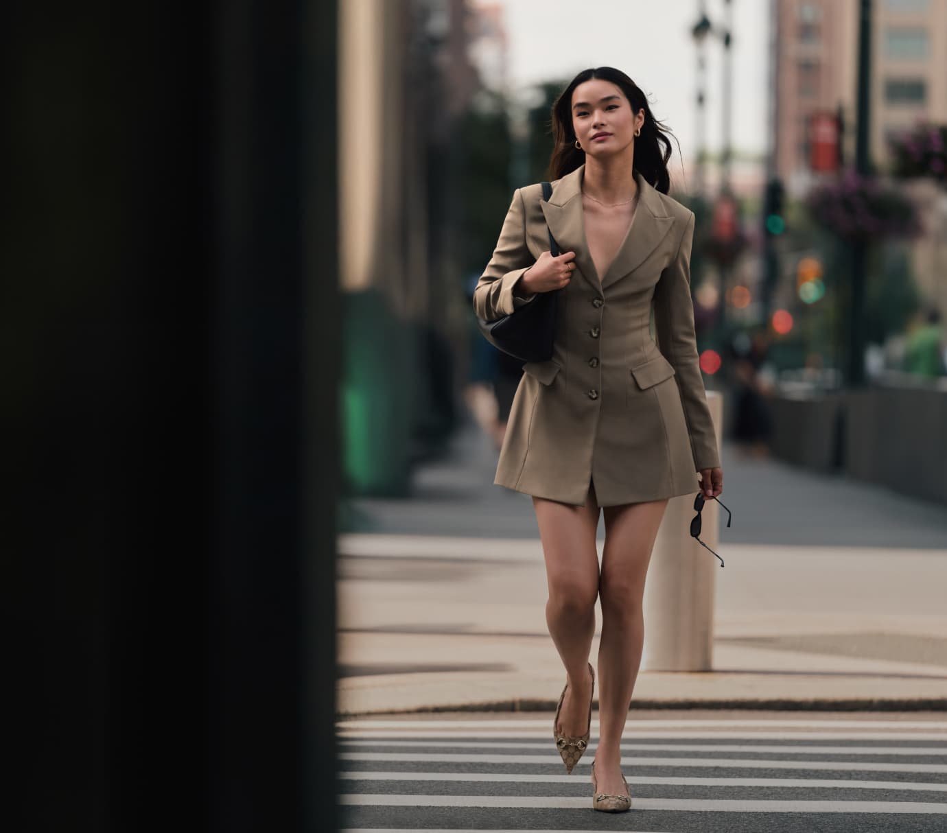 Model is wearing a brown blazer dress.