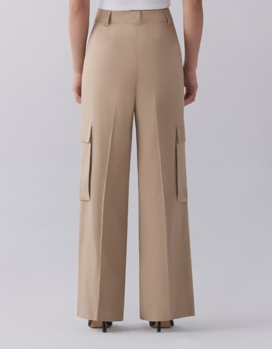 A model wears the Gemma cargo pants - back view.