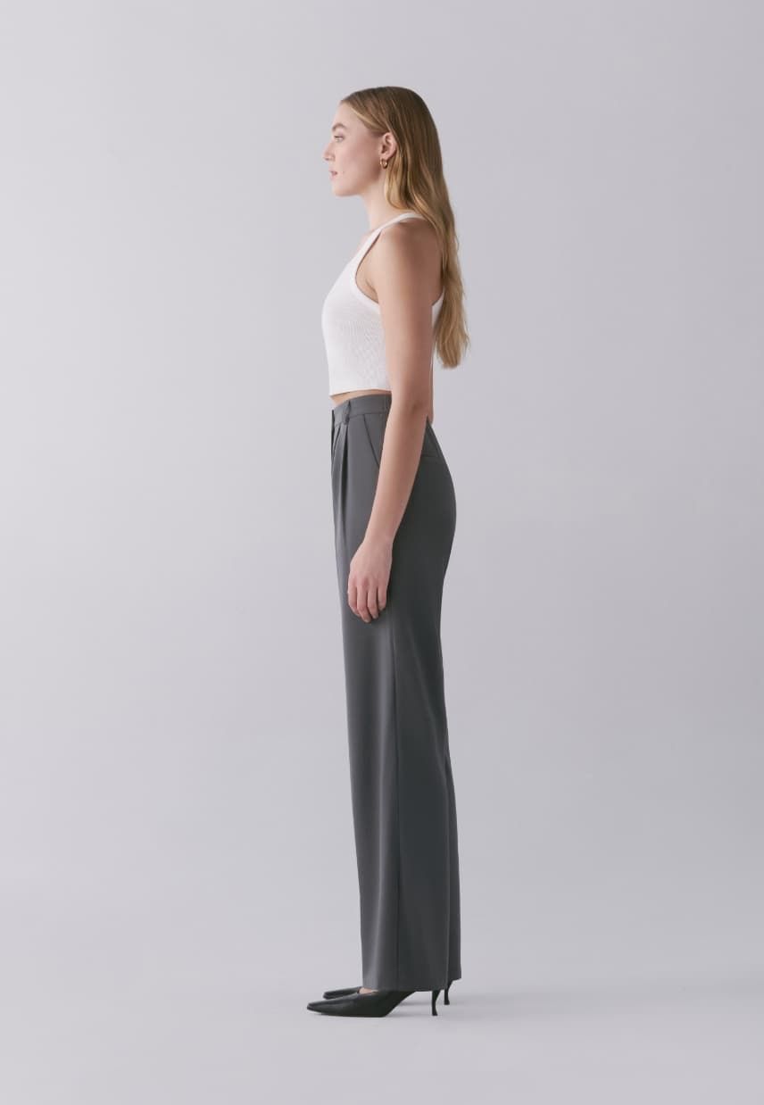 A model wears the Lila pleated straight leg pants.