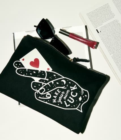 Forensics & flowers luck pouch on table.