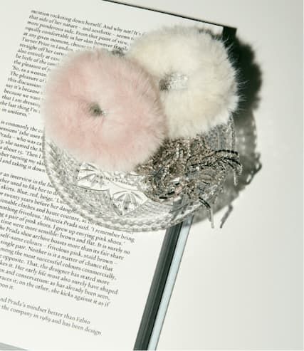 Pink and white faux fur scrunchies.